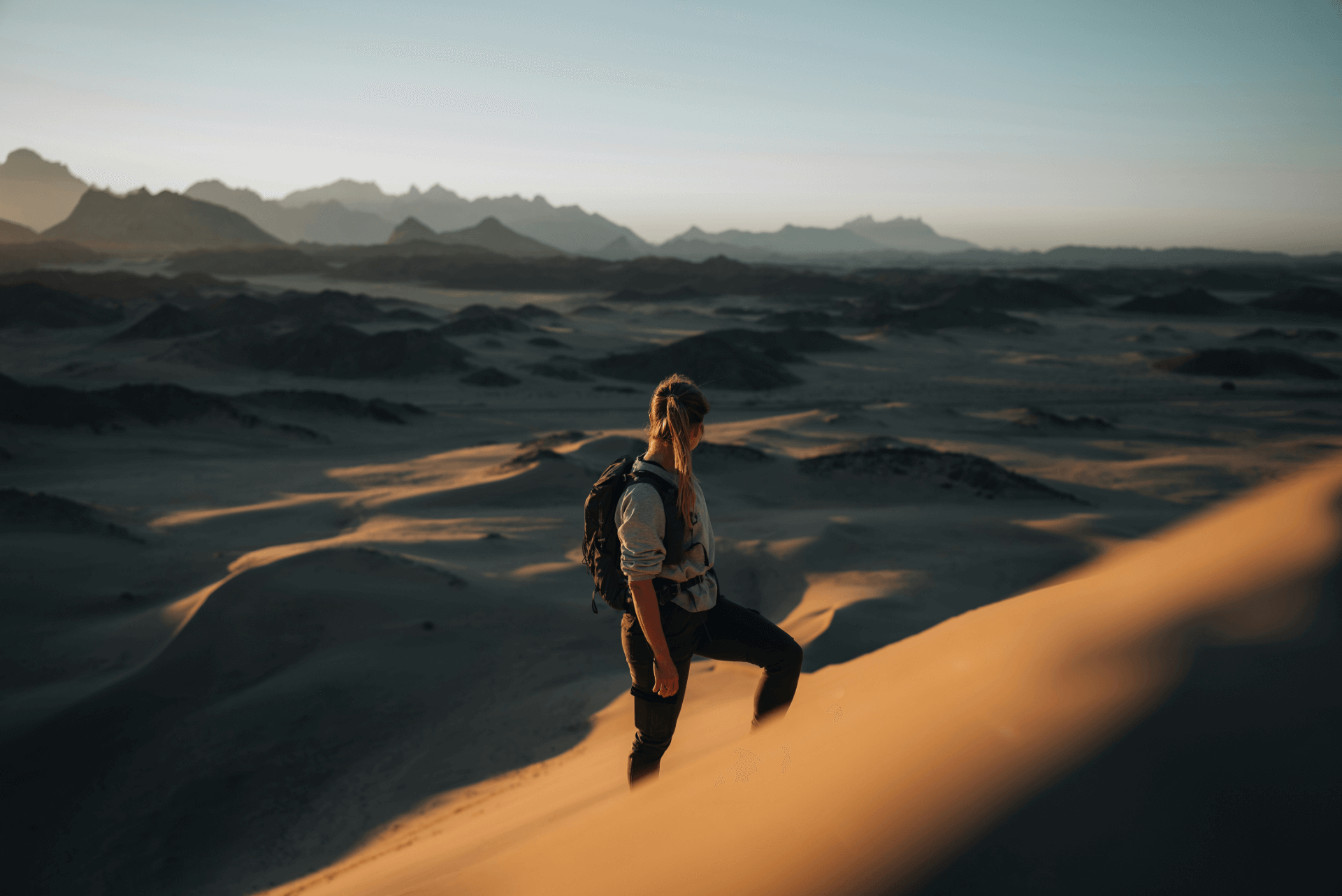 Backpacker standing in desert